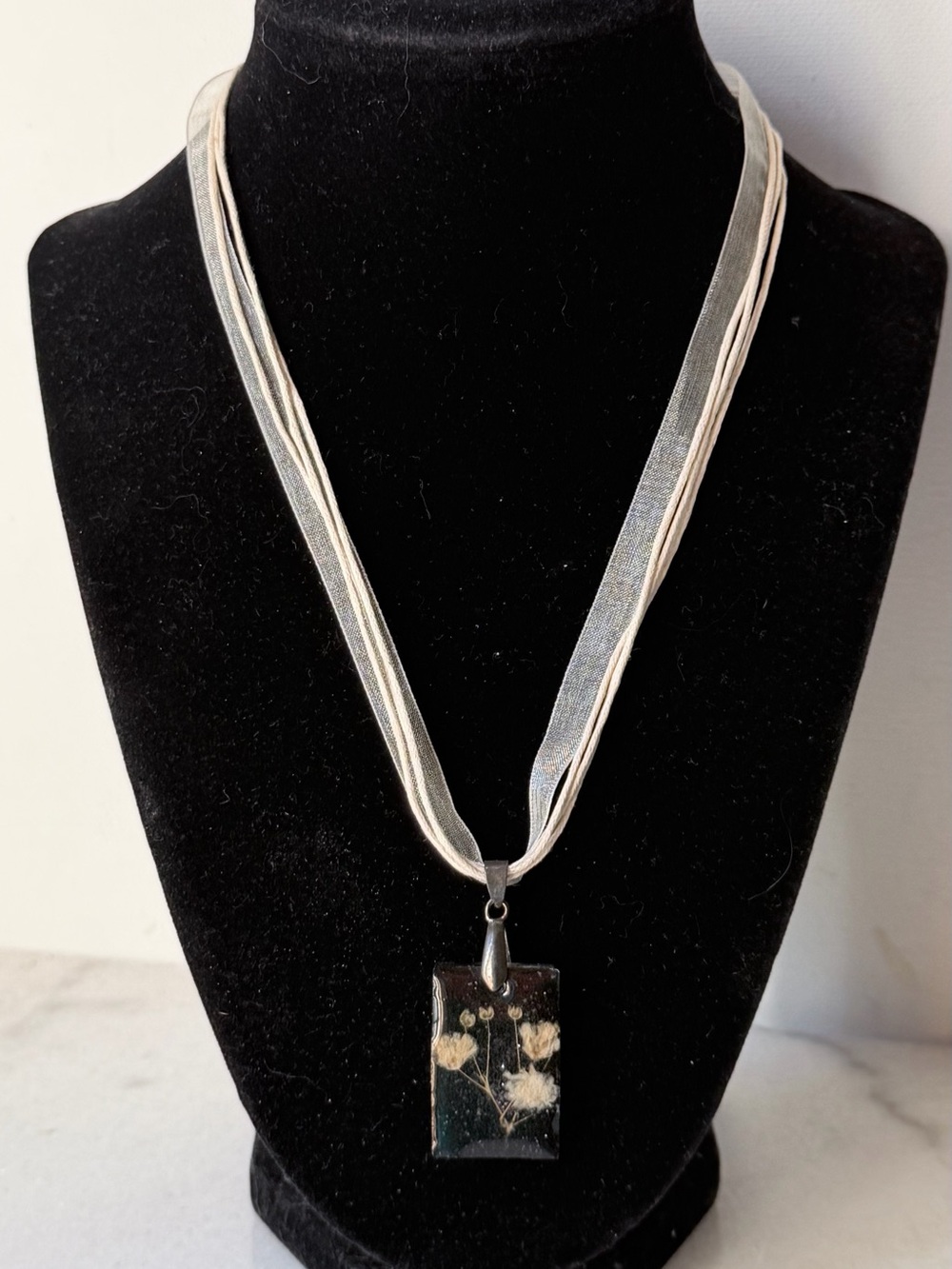 Handmade Botanical Resin Pendant Necklace in Cream on Multi-Strand Ribbon